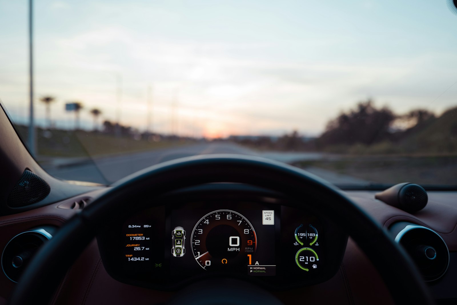 A close view of a car instrument cluster with the odometer reading visible.