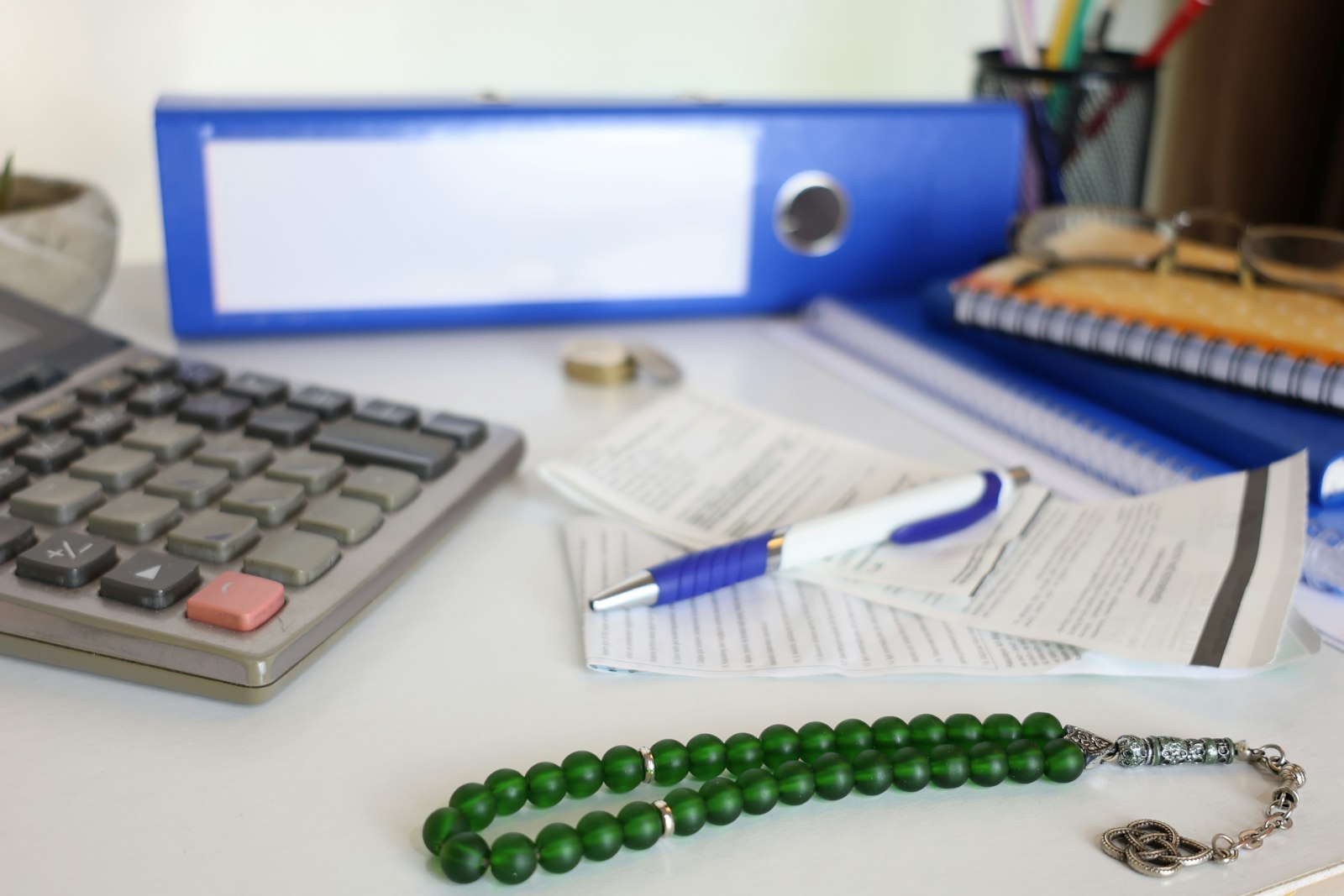 A folder of maintenance receipts and service records spread open on a desk.